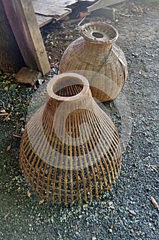 Bamboo fish trap and creel for fresh water fish in the river in Thailand