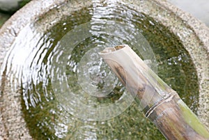 Bamboo flowing water in Japanese zen garden