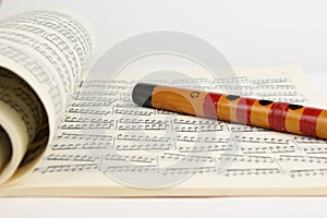 Bamboo flute and Music Sheet photo