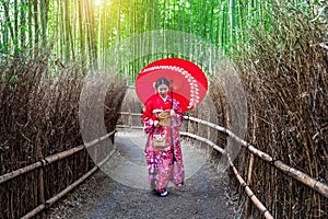 Bamboo Forest. Asian woman wearing japanese traditional kimono at Bamboo Forest in Kyoto, Japan