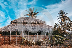 Bamboo house and fence at tropical background