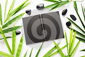 Bamboo leaf background. Black sketchbook spread notebook mockup.