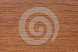 Bamboo mat closeup. Thin strips of wood sewn into fabric. Decorative textured backdrop. Horizontal template of background for