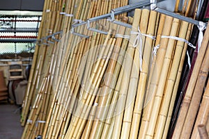 Bamboo poles in gardening shop or storage house
