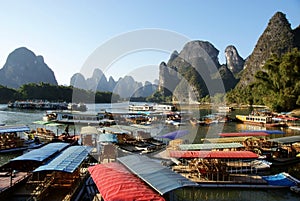 Bamboo raft with colorful roof in xingping village photo