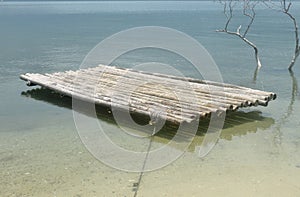 Bamboo raft is floating in the lagoon