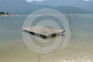 Bamboo raft is floating in the lagoon