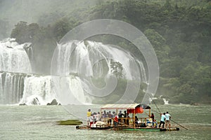 Bamboo Raft with tourists at Ban Gioc Waterfall, Vietnam