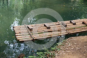 Bamboo raft A way to travel by water. The human used since ancient times. . Waterfall in Krabi province Thailand.
