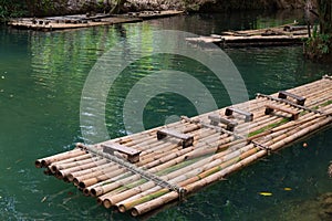 Bamboo raft A way to travel by water. The human used since ancient times. . Waterfall in Krabi province Thailand.