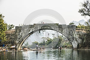 Bamboo rafting along Yulong River during the winter season with beauty of the landscape is a popular activity in Guilin.