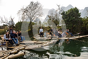 Bamboo rafting along Yulong River during the winter season with beauty of the landscape is a popular activity in Guilin.