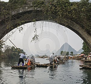 Bamboo rafting along Yulong River during the winter season with beauty of the landscape is a popular activity in Guilin.