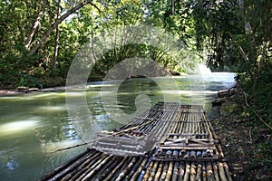 Bamboo rafts prepared & ready for a popular tourist day trip on the Martha Brae river, Falmouth, Jamaica. Close to Montego Bay.