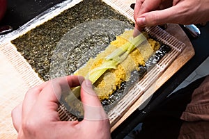 Bamboo rolling mat for homemade sushi with nori, ricota, quinoa and cucumber