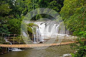 The bamboo rope bridge in Tad Pha Souam waterfall, Laos.