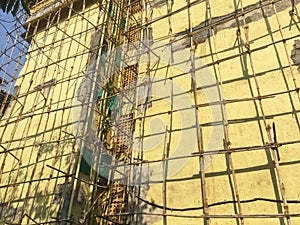 Bamboo Scaffolding on twenty five year old four storey building gating structural Repair work