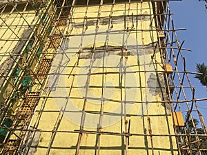 Bamboo Scaffolding on twenty five year old four storey building gating structural Repair work