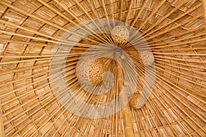 Bamboo shingle roof with woven bamboo hanging folk art