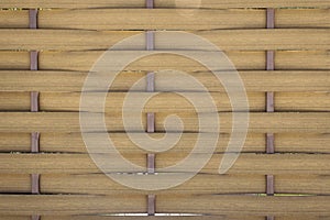 Bamboo straw mat. Abstract background texture of wicker bamboo fence