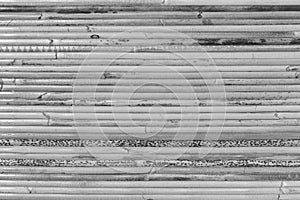 Bamboo straw mat as abstract texture background composition, top view above. Black and white