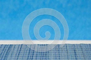 Bamboo straw mat with swimming pool blue background