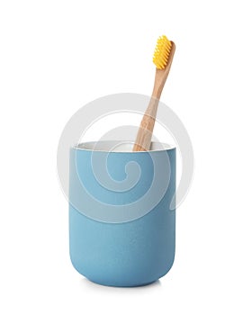 Bamboo toothbrush in holder