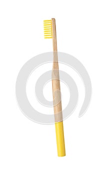 Bamboo toothbrush on white background.