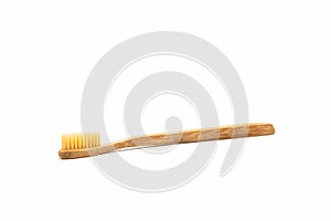 Bamboo toothbrush on white background