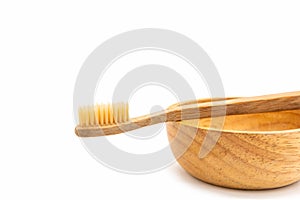 Bamboo toothbrush on white background