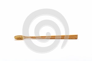 Bamboo toothbrush on white background