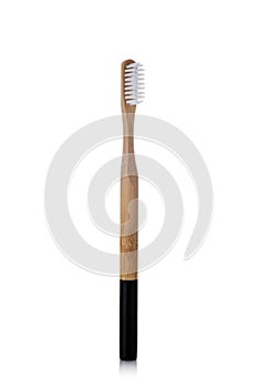 Bamboo toothbrush on a white background