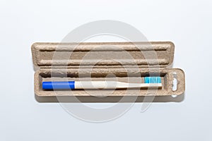 Bamboo toothbrush on a white background Ecological and sustainable product concept.