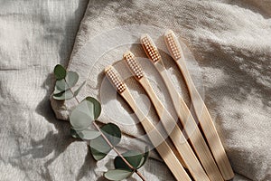 Bamboo toothbrushes on linen fabric