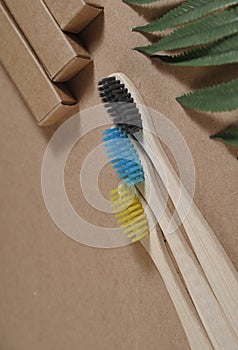 Bamboo toothbrushes on stone background.