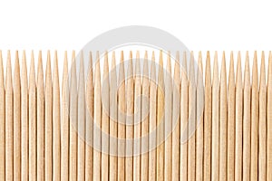 Bamboo toothpicks are placed in parallel - backgrounds, textures. Bamboo toothpicks isolated on white background