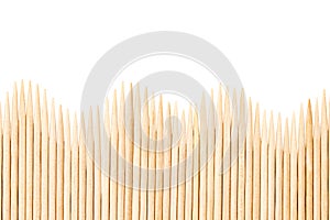 Bamboo toothpicks are placed in parallel - backgrounds, textures. Bamboo toothpicks isolated on white background