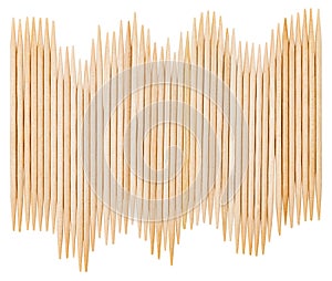 Bamboo toothpicks are placed in parallel - backgrounds, textures. Bamboo toothpicks isolated on white background