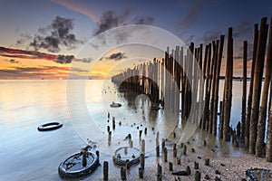 Bamboo wall in the sea and beautiful sunrise at Saphan Hin,