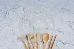 Bamboo wood toothbrush on clean white marble table top view background concept for save the earth day, world environmental,