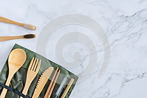 Bamboo wood toothbrush on clean white marble table top view background concept for save the earth day, world environmental,