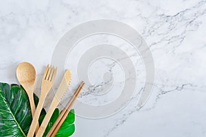 Bamboo wood toothbrush on clean white marble table top view background concept for save the earth day, world environmental,