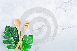 Bamboo wood toothbrush on clean white marble table top view background concept for save the earth day, world environmental,