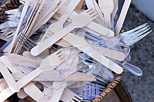 Bamboo wooden and plastic forks in basket for food truck fastfood