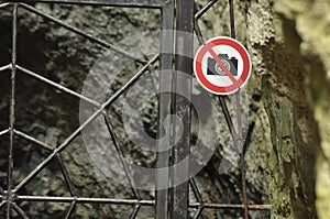 The ban on photographing the object. A sign at the entrance gate metal. The caves in the national park. Paternal National Park. photo