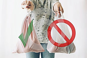Ban single use plastic, stop sign. Choose plastic free. Zero Waste shopping concept. Woman holding in one hand groceries in