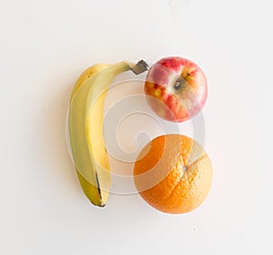 Banana, apple and orange from above