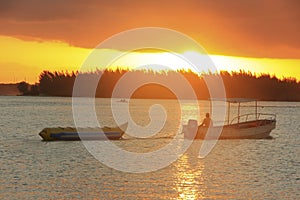 Banana boat in Boca Chica bay at sunset