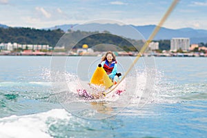 Banana boat ride. Kids on the beach