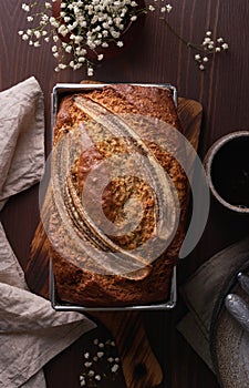 Banana bread. Cake with banana, traditional american cuisine. Whole loaf. Vertical, close up